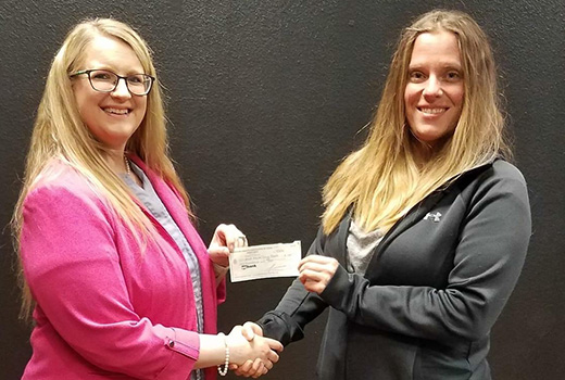 Holly Radke presents donation to Heather Howe for the Minot Adult Drug Court ND Attorney General with WDALA members 2017
